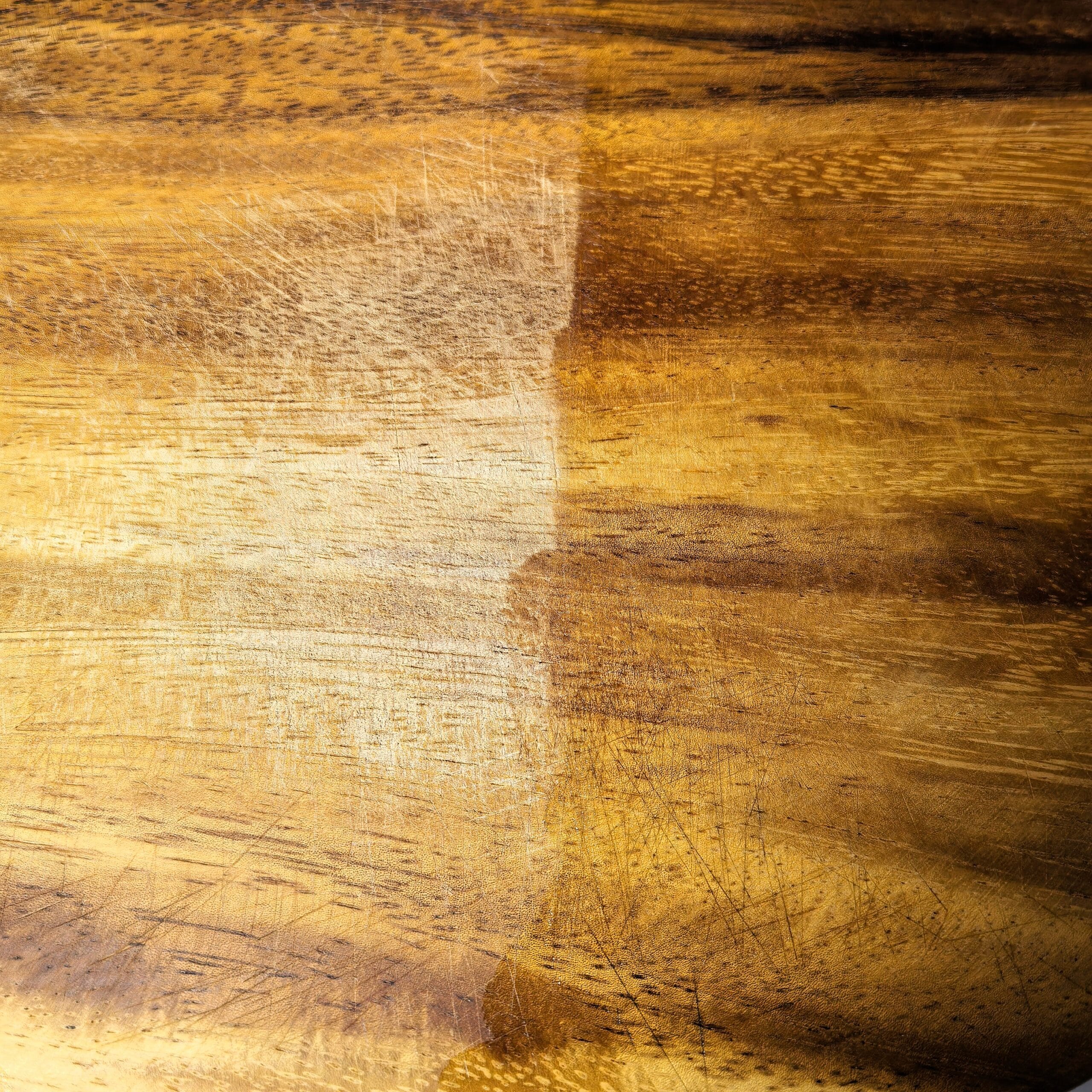 Buffed wooden cutting board after wax treatment