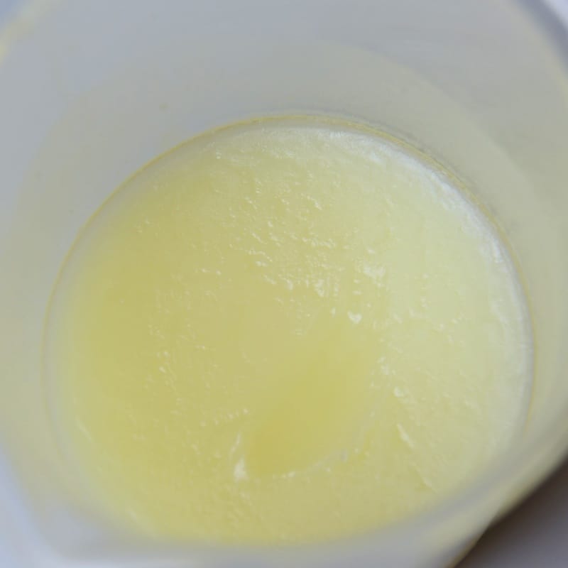 White creamy leather conditioner texture enriched with neatsfoot oil.